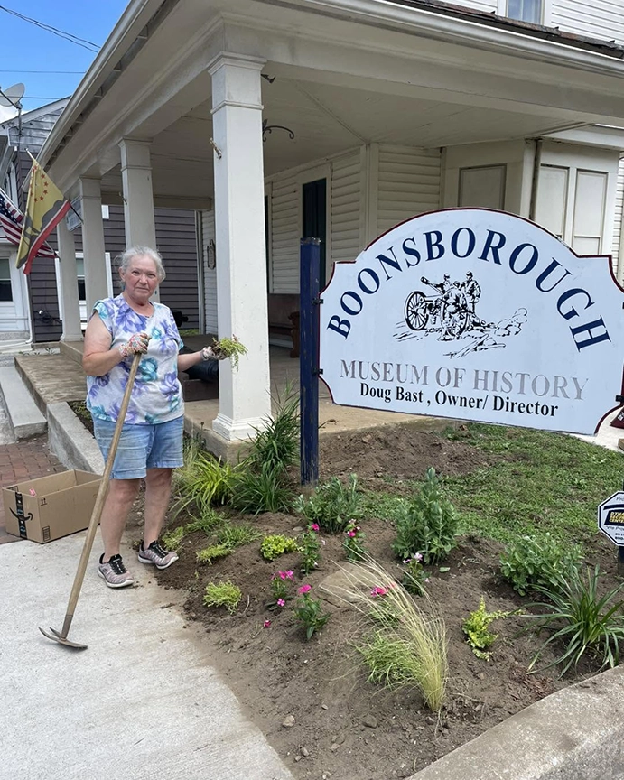Brenda Hollar, beautification volunteer stands next to her work, helping beautify the BMOH.